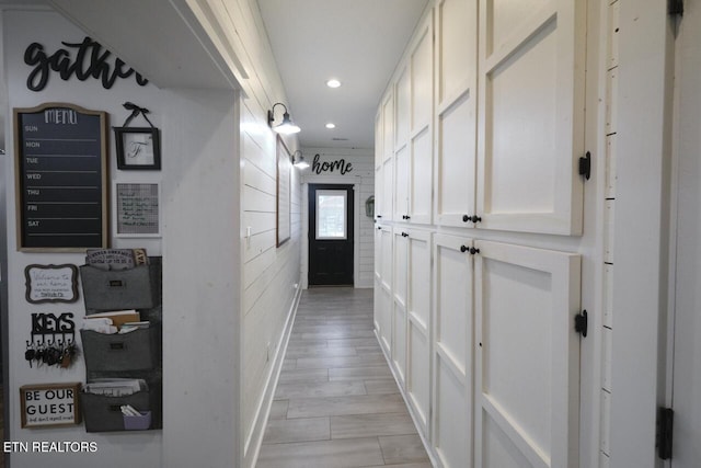 corridor with light hardwood / wood-style flooring