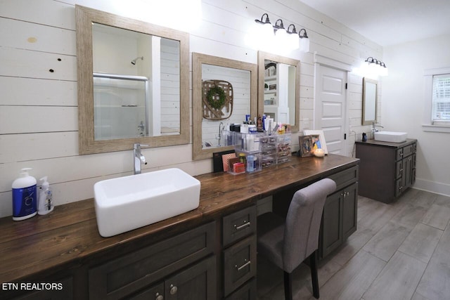 bathroom with wooden walls and vanity