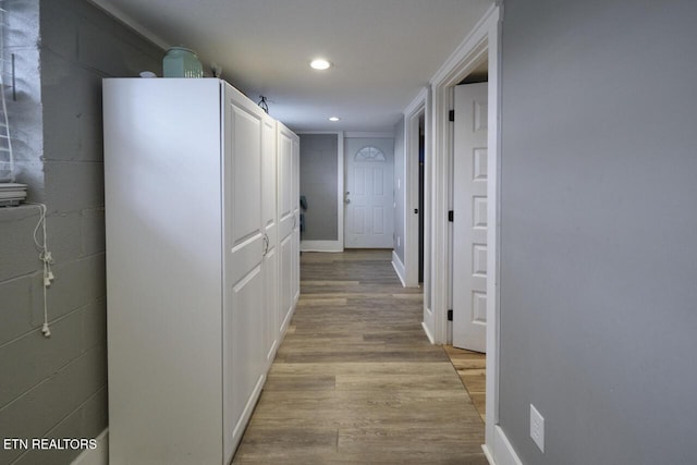 corridor with light hardwood / wood-style floors