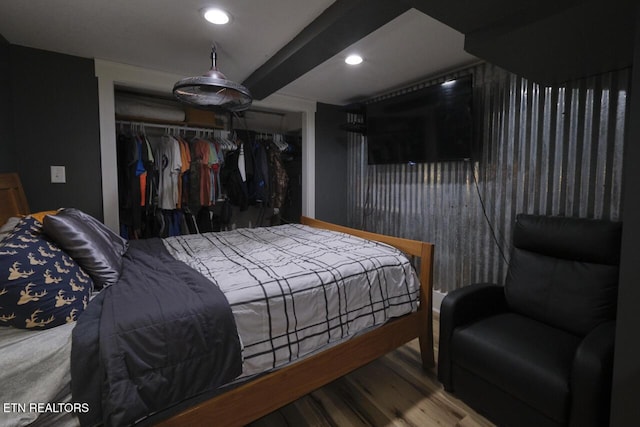 bedroom featuring a closet and wood-type flooring