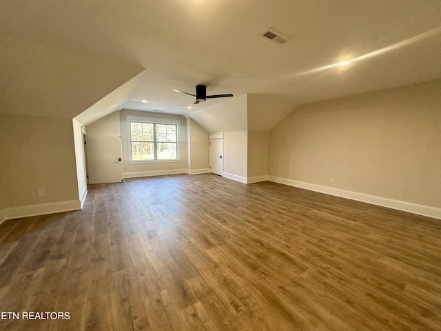 bonus room featuring vaulted ceiling, ceiling fan, and dark hardwood / wood-style floors