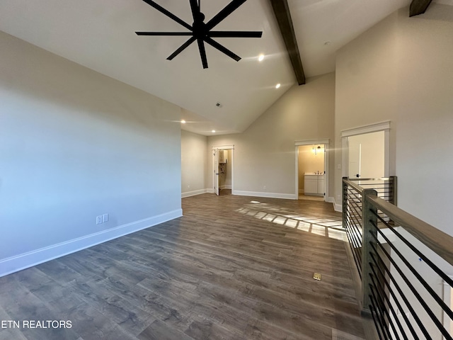 unfurnished living room featuring ceiling fan, beamed ceiling, dark hardwood / wood-style flooring, and high vaulted ceiling