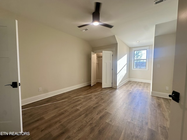 additional living space with ceiling fan, dark wood-type flooring, and lofted ceiling