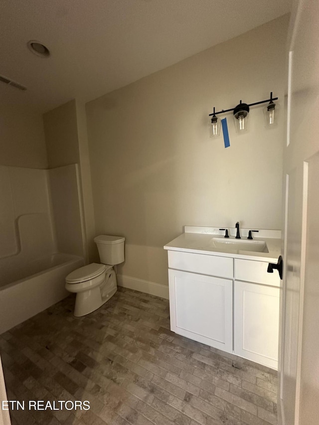 full bathroom featuring toilet, vanity, and bathing tub / shower combination