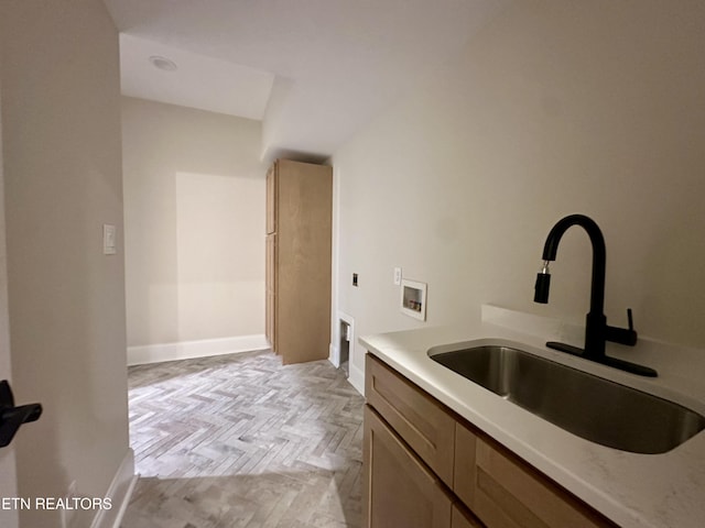 bathroom with vanity and baseboards