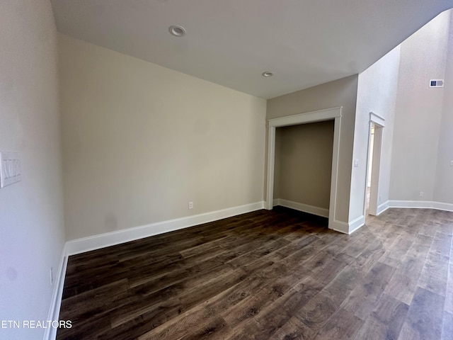 unfurnished bedroom with dark wood finished floors, recessed lighting, visible vents, and baseboards