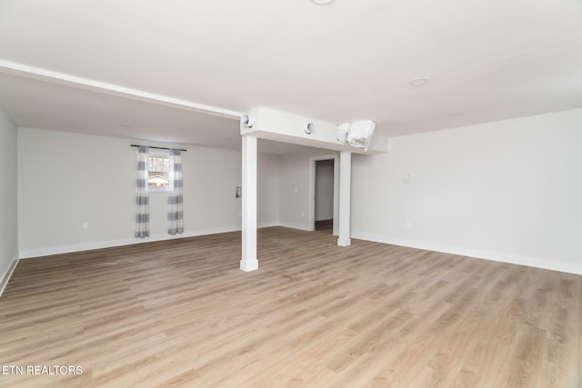 basement featuring light wood-type flooring