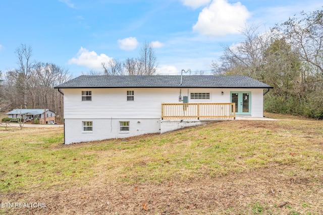 back of house with a lawn, a deck, and french doors