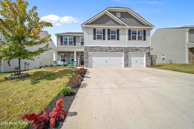 view of front facade featuring a front lawn and a garage