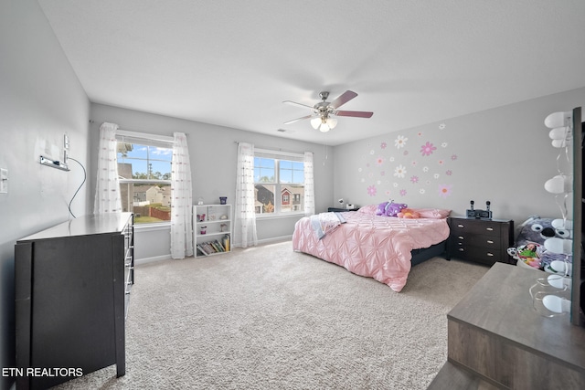 carpeted bedroom with ceiling fan