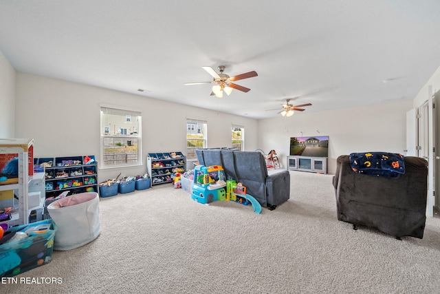 game room with carpet flooring and ceiling fan