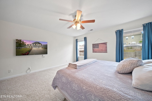 carpeted bedroom featuring ceiling fan