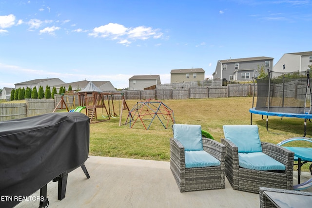 view of patio / terrace featuring a playground, a grill, and a trampoline