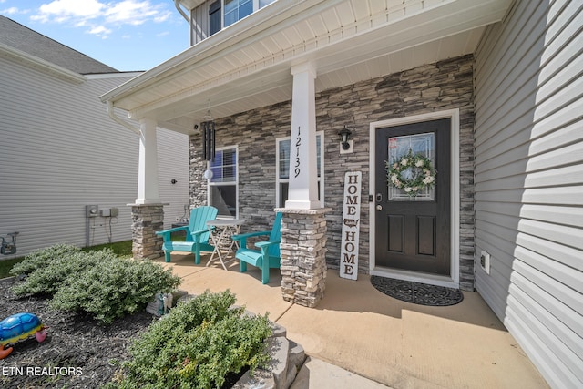 property entrance with covered porch