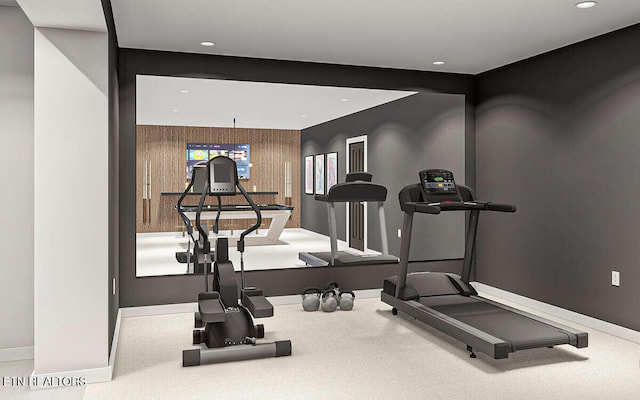 exercise area with wooden walls and carpet