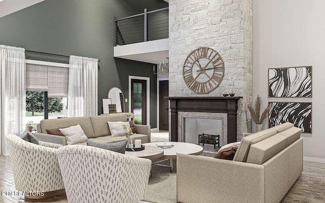 living room with a high ceiling, light hardwood / wood-style flooring, and a stone fireplace