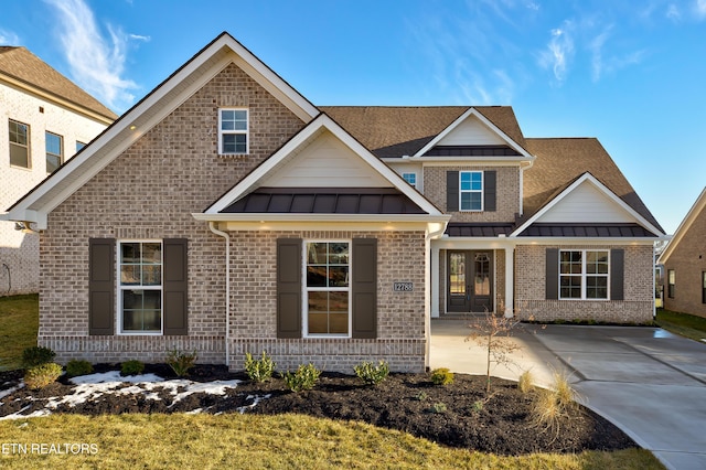 craftsman-style house with a front lawn