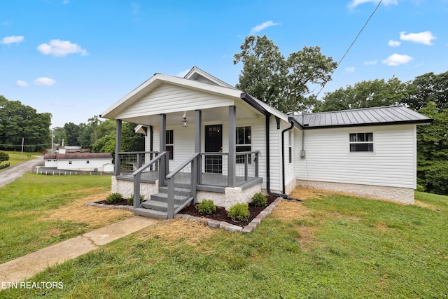 bungalow featuring a front yard and a porch