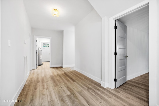 hall with light wood-type flooring