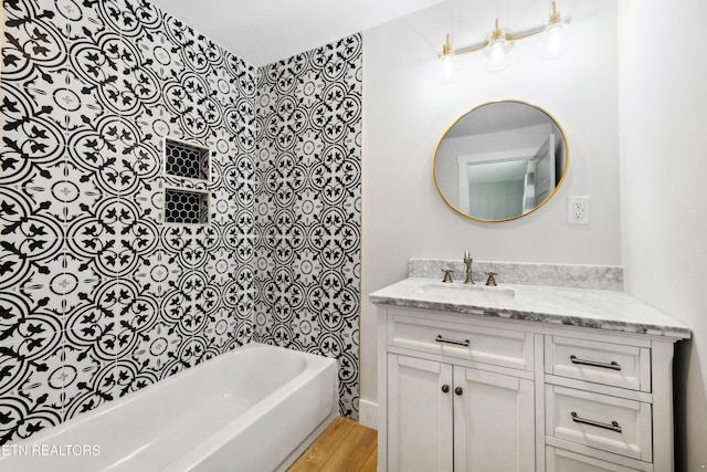 bathroom with vanity and hardwood / wood-style flooring