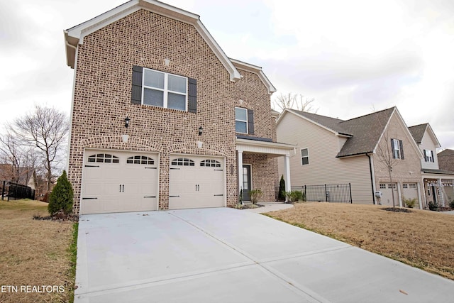 front facade featuring a garage and a front yard