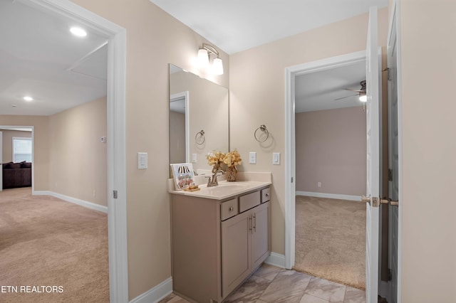 bathroom with ceiling fan and vanity