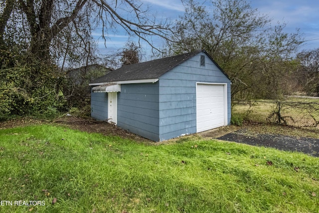 view of outbuilding with a garage