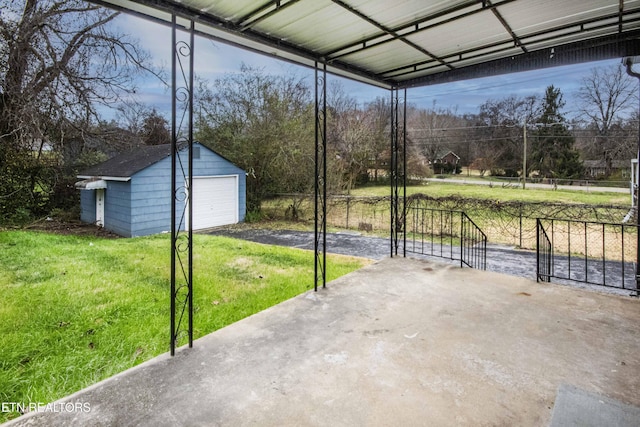 view of patio / terrace featuring an outbuilding and a garage