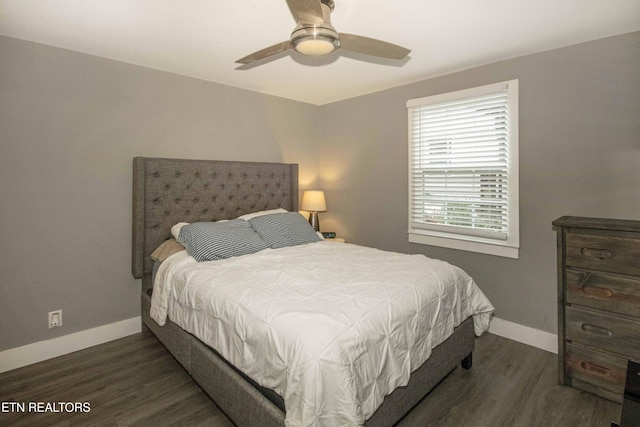 bedroom featuring ceiling fan and dark hardwood / wood-style flooring