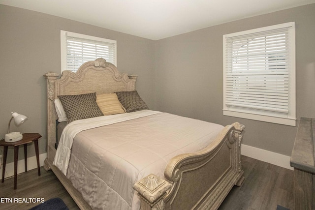 bedroom featuring dark wood-type flooring