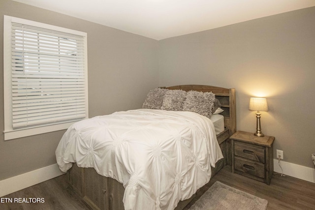 bedroom featuring dark hardwood / wood-style flooring