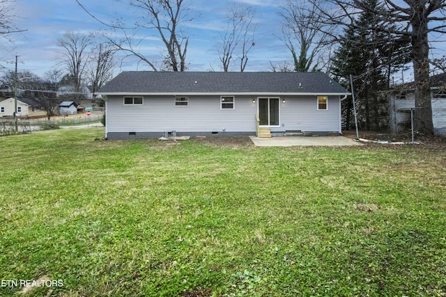 rear view of property with a patio area and a lawn