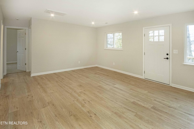 entryway with light hardwood / wood-style floors