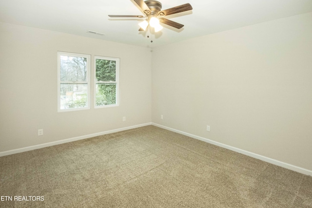 spare room with carpet flooring and ceiling fan