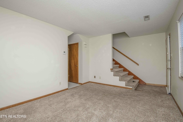 interior space featuring a textured ceiling