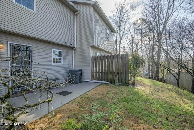 view of yard featuring a patio and central AC unit