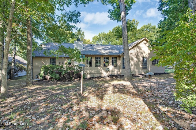 view of front of property with a wooden deck