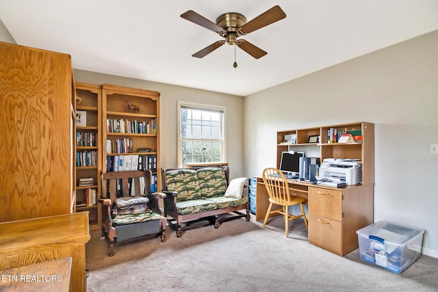 office space with ceiling fan and light colored carpet