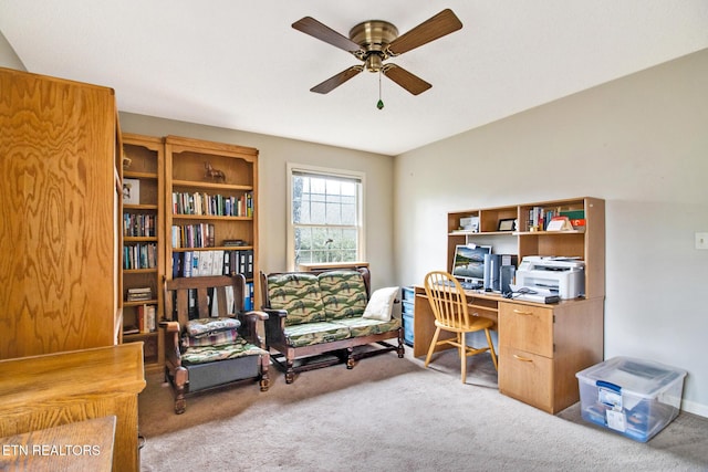 home office featuring ceiling fan and light colored carpet