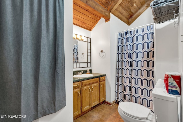 bathroom featuring hardwood / wood-style floors, vanity, vaulted ceiling with beams, toilet, and wood ceiling