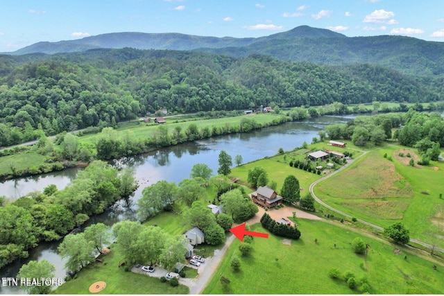 drone / aerial view with a water and mountain view