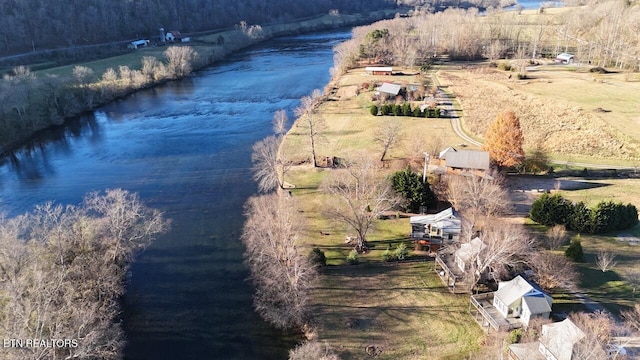 birds eye view of property with a water view and a rural view