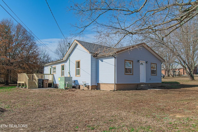 view of home's exterior with central AC unit