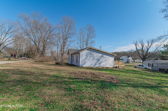 view of property exterior featuring a yard