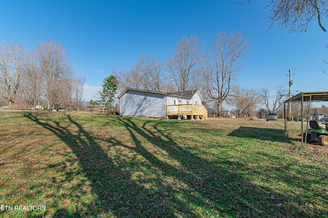 view of yard with a wooden deck