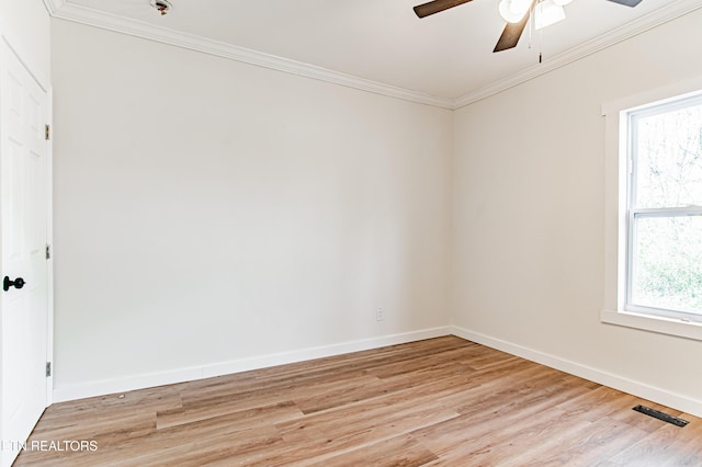 unfurnished room featuring light hardwood / wood-style floors and ornamental molding