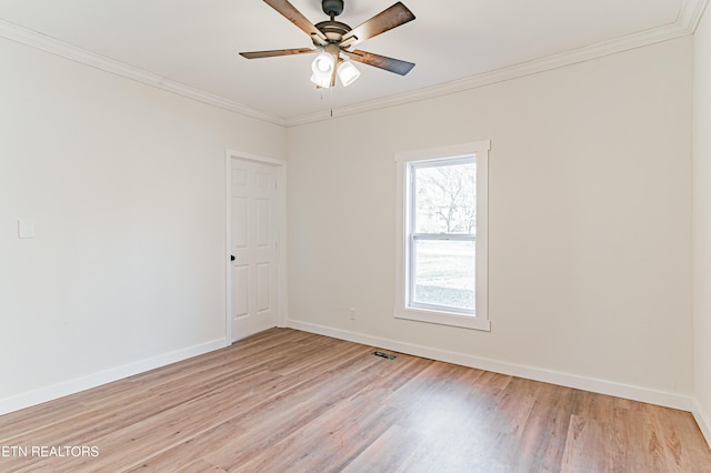 empty room with light hardwood / wood-style flooring, ceiling fan, and crown molding