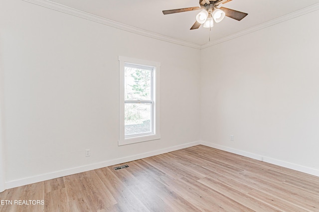 spare room with crown molding, ceiling fan, and light wood-type flooring