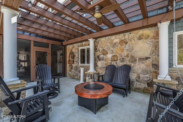 view of patio with a pergola, ceiling fan, and an outdoor fire pit