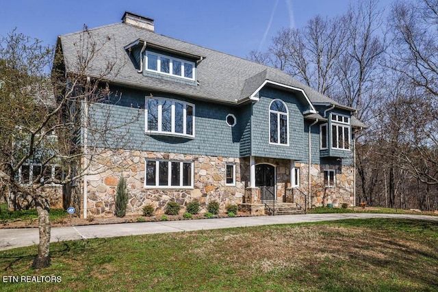 front facade with a front lawn